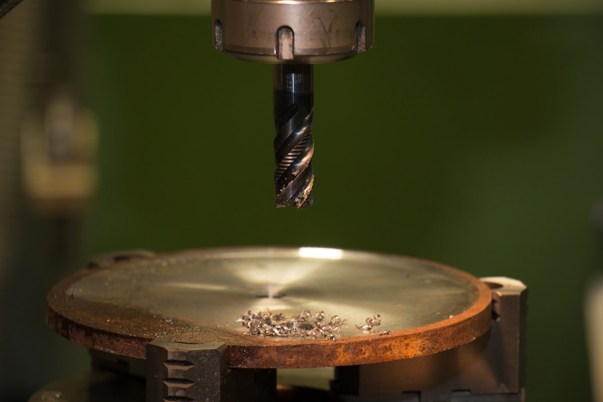 Boring tool machining a metal component in a workshop