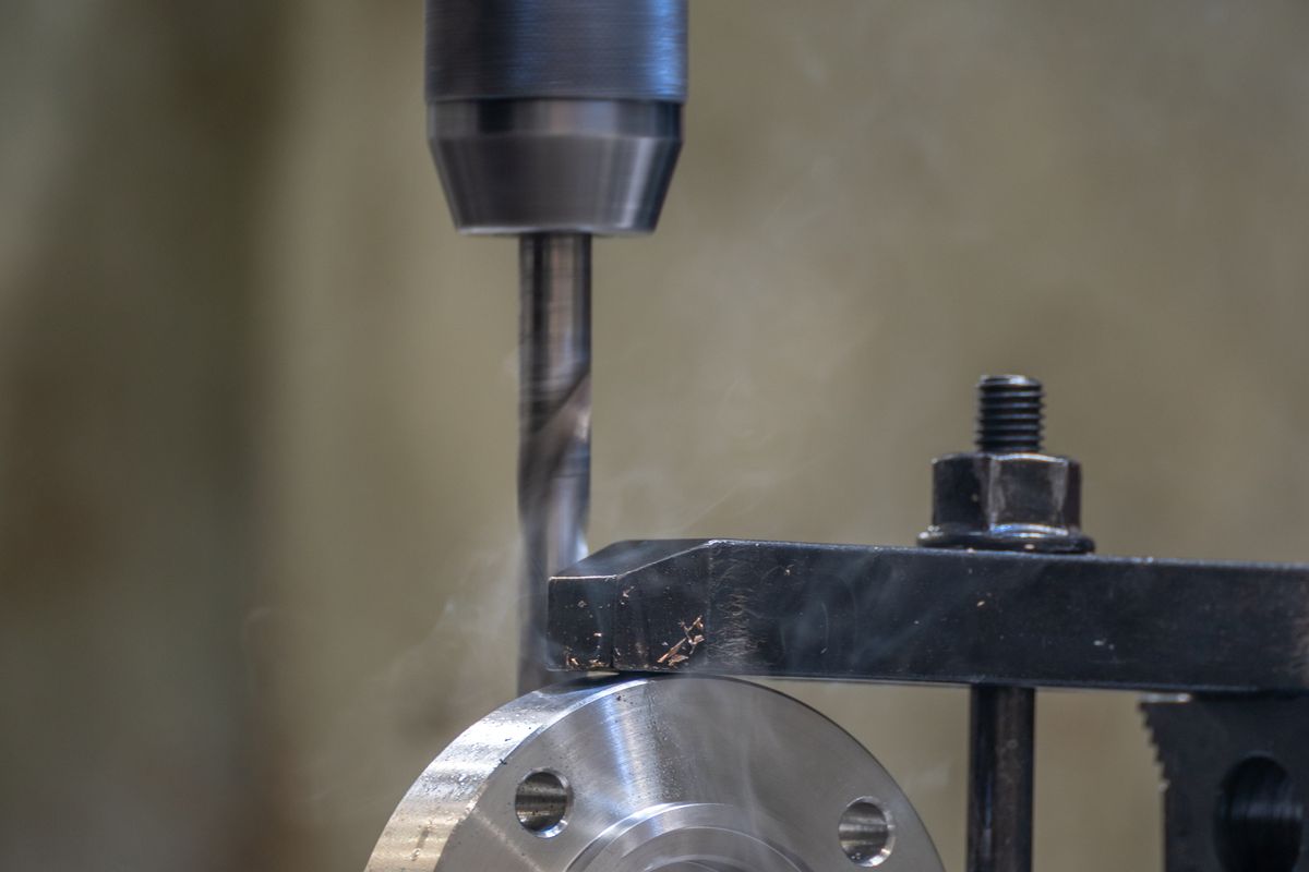 Precision boring operation cutting a hole in metal