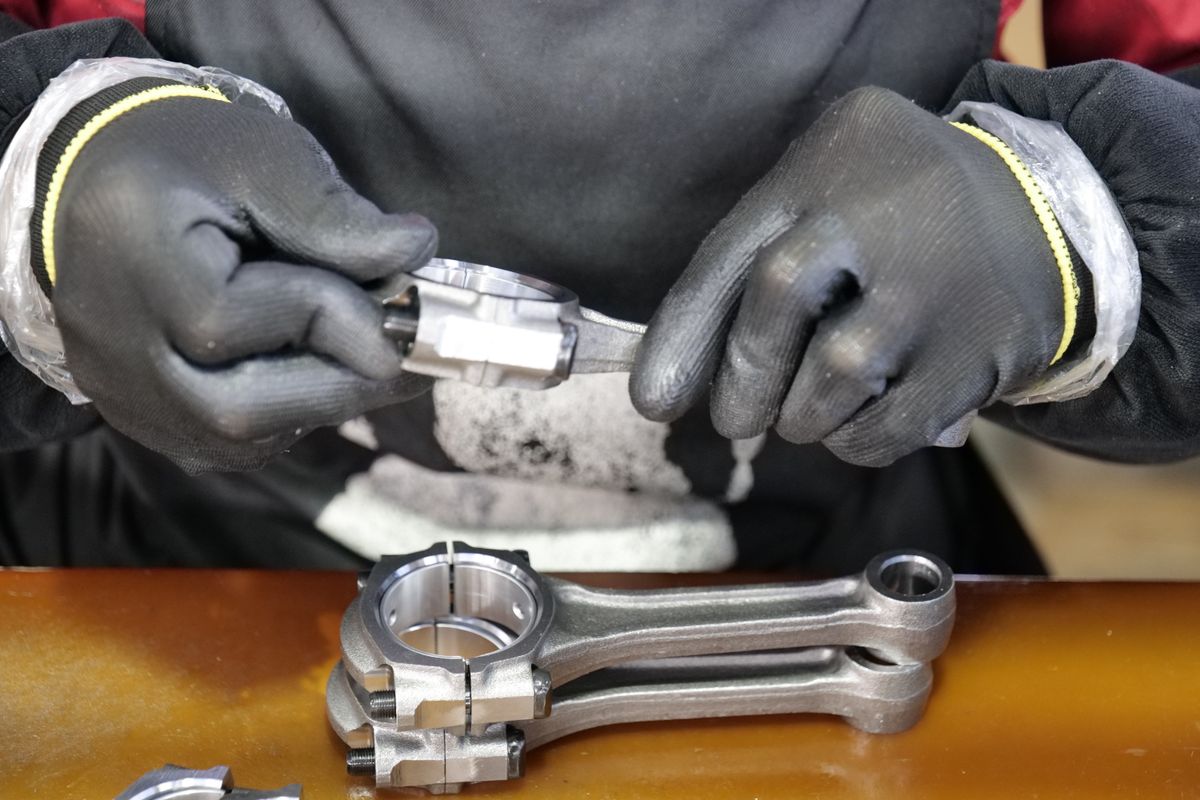 Connecting rod being assembled on a workshop bench